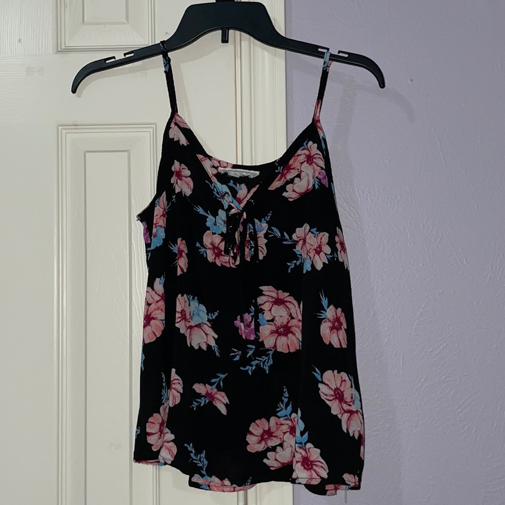 Black tank top with pink flowers. Size medium.